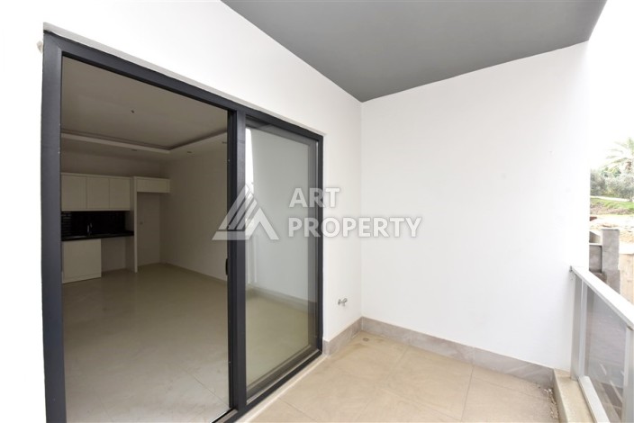 Квартира 1+1 в Махмутларе в новой резиденции, 50 м² - Ракурс 7