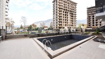 Квартира 1+1 в Махмутларе в новой резиденции, 50 м² - Ракурс 17