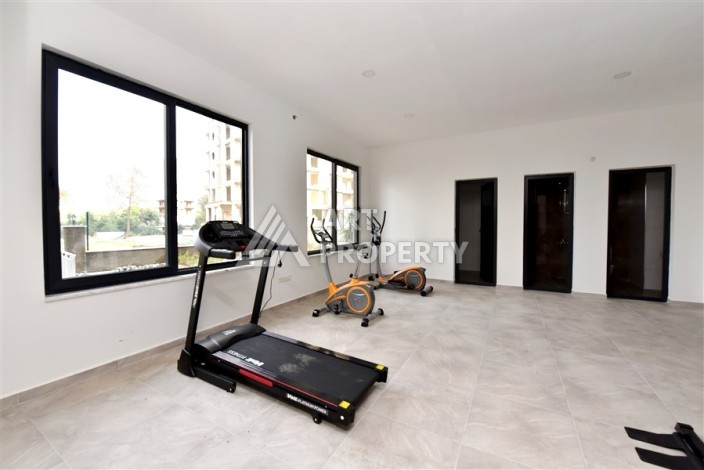 Квартира 1+1 в Махмутларе в новой резиденции, 50 м² - Ракурс 22