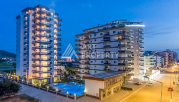 Квартира 1+1 с видом на море в Махмутларе, 65 м² - Ракурс 2