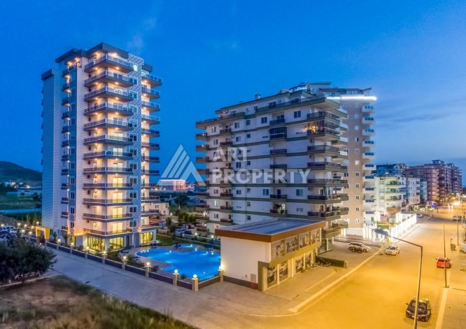 Квартира 1+1 с видом на море в Махмутларе, 65 м² - Ракурс 1
