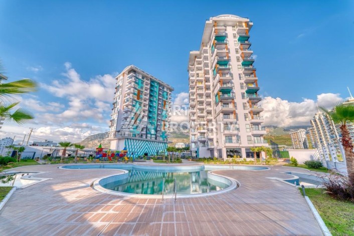 Квартира 1+1 60 м² в ЖК с инфраструктурой отельного типа в Махмутларе - Ракурс 1