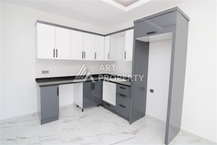 Квартира 1+1 в центре Махмутлара возле субботнего рынка, 50 м² - Ракурс 4
