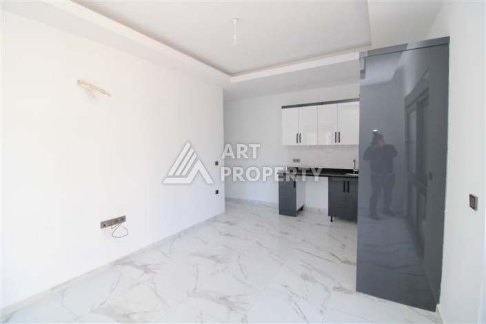Квартира 1+1 в центре Махмутлара возле субботнего рынка, 50 м² - Ракурс 6