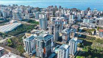 Квартира 2+1 в Махмутларе с видом на море, 75 кв.м. - Ракурс 1