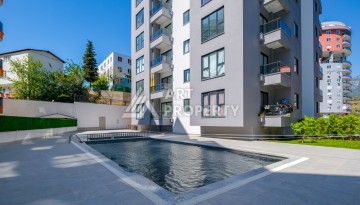 Квартира 2+1 - 85 м² в 5 минутах от вторничного рынка в Махмутларе - Ракурс 2