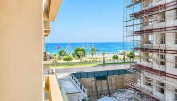 Квартира 1+1 в Махмутларе на первой береговой линии, 55 м² - Ракурс 2