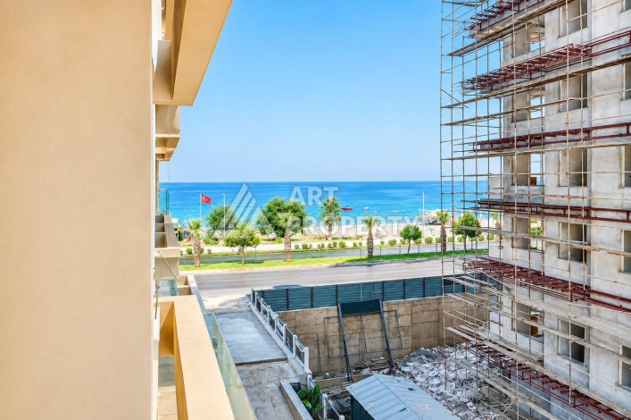 Квартира 1+1 в Махмутларе на первой береговой линии, 55 м² - Ракурс 1