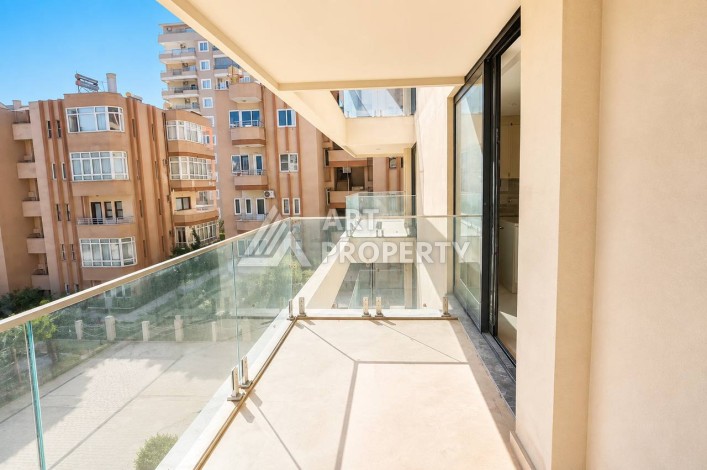 Квартира 1+1 в Махмутларе на первой береговой линии, 55 м² - Ракурс 5