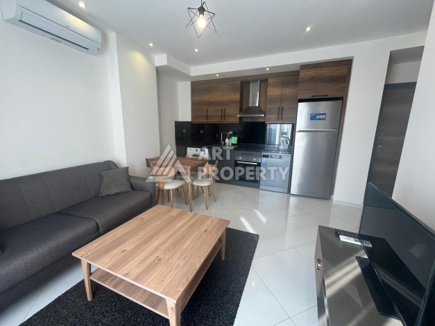 Квартира 1+1 с видом на море и бассейн, 55 м². Махмутлар, Алания - Ракурс 1