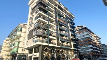 Квартира 1+1 в Махмутларе, 60 м², рядом с морем - Ракурс 1