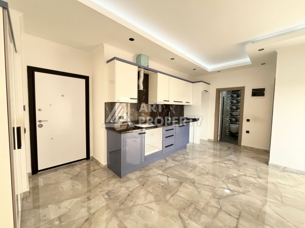 Квартира 1+1 в Махмутларе, 60 м², рядом с морем - Ракурс 7