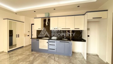 Квартира 1+1 в Махмутларе, 60 м², рядом с морем - Ракурс 9