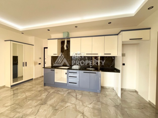 Квартира 1+1 в Махмутларе, 60 м², рядом с морем - Ракурс 8