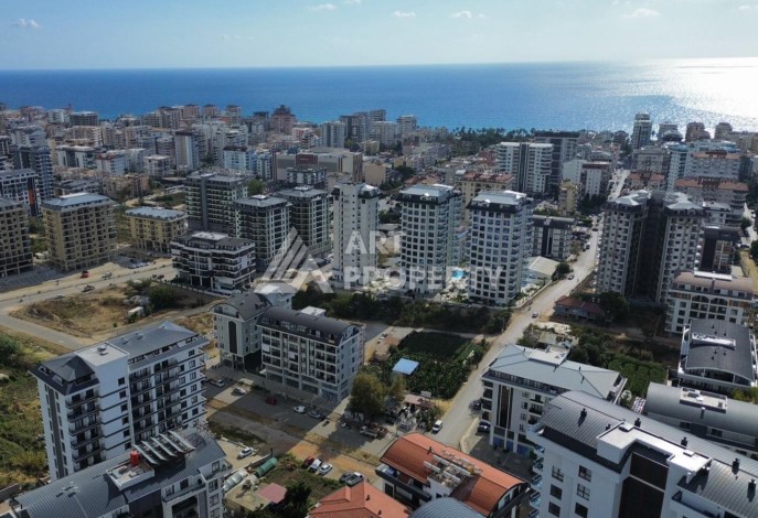 Квартира 1+1 в новом доме в центре Махмутлара, 55 м² - Ракурс 0