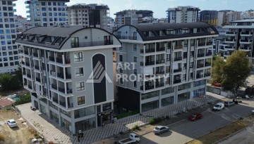 Квартира 1+1 в новом доме в центре Махмутлара, 55 м² - Ракурс 2