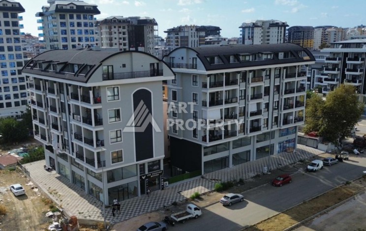 Квартира 1+1 в новом доме в центре Махмутлара, 55 м² - Ракурс 1