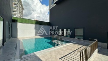 Квартира 1+1 в новом доме в центре Махмутлара, 55 м² - Ракурс 3