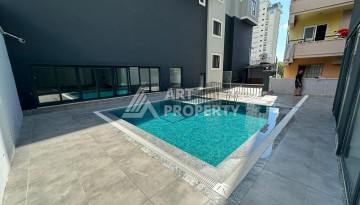 Квартира 1+1 в новом доме в центре Махмутлара, 55 м² - Ракурс 4