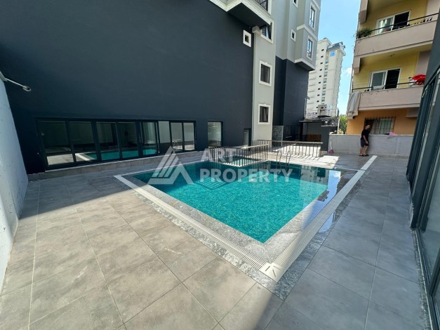 Квартира 1+1 в новом доме в центре Махмутлара, 55 м² - Ракурс 3