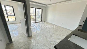 Квартира 1+1 в новом доме в центре Махмутлара, 55 м² - Ракурс 5