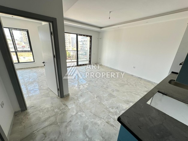 Квартира 1+1 в новом доме в центре Махмутлара, 55 м² - Ракурс 4