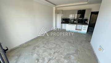 Квартира 1+1 в новом доме в центре Махмутлара, 55 м² - Ракурс 6