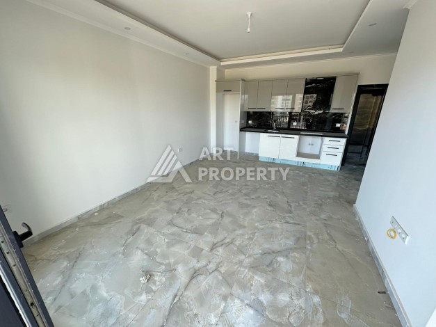Квартира 1+1 в новом доме в центре Махмутлара, 55 м² - Ракурс 5