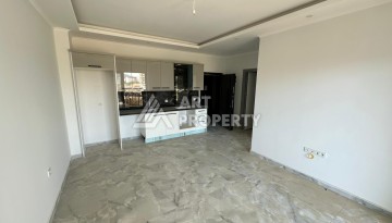 Квартира 1+1 в новом доме в центре Махмутлара, 55 м² - Ракурс 7