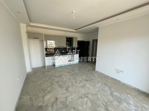 Квартира 1+1 в новом доме в центре Махмутлара, 55 м² - Ракурс 6