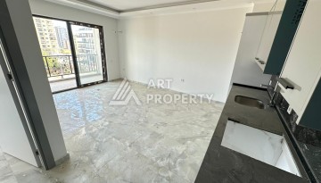 Квартира 1+1 в новом доме в центре Махмутлара, 55 м² - Ракурс 8