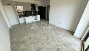 Квартира 1+1 в новом доме в центре Махмутлара, 55 м² - Ракурс 10