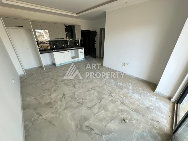 Квартира 1+1 в новом доме в центре Махмутлара, 55 м² - Ракурс 9