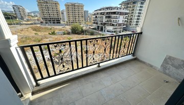 Квартира 1+1 в новом доме в центре Махмутлара, 55 м² - Ракурс 11