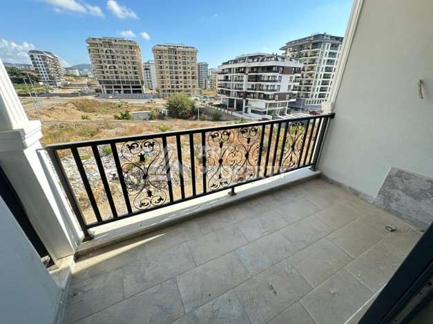 Квартира 1+1 в новом доме в центре Махмутлара, 55 м² - Ракурс 10