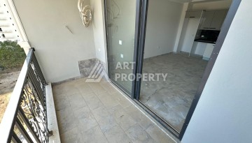Квартира 1+1 в новом доме в центре Махмутлара, 55 м² - Ракурс 12