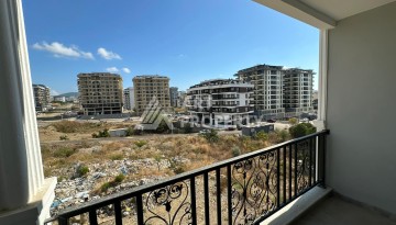 Квартира 1+1 в новом доме в центре Махмутлара, 55 м² - Ракурс 13
