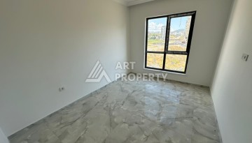 Квартира 1+1 в новом доме в центре Махмутлара, 55 м² - Ракурс 14