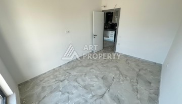 Квартира 1+1 в новом доме в центре Махмутлара, 55 м² - Ракурс 15