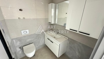 Квартира 1+1 в новом доме в центре Махмутлара, 55 м² - Ракурс 16