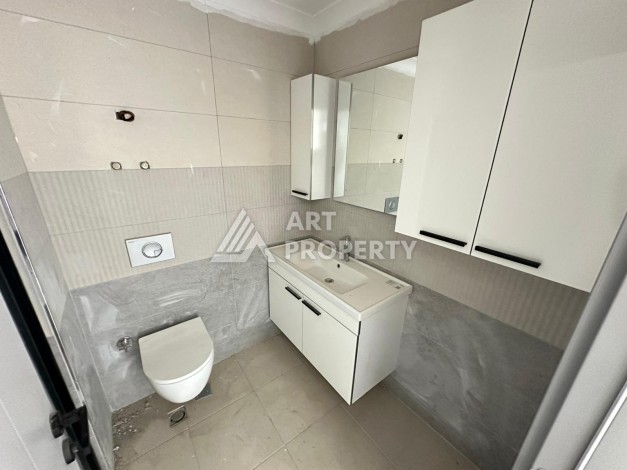 Квартира 1+1 в новом доме в центре Махмутлара, 55 м² - Ракурс 15