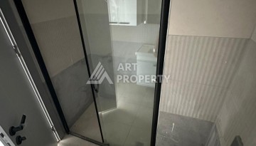 Квартира 1+1 в новом доме в центре Махмутлара, 55 м² - Ракурс 17