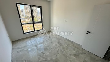 Квартира 1+1 в новом доме в центре Махмутлара, 55 м² - Ракурс 18