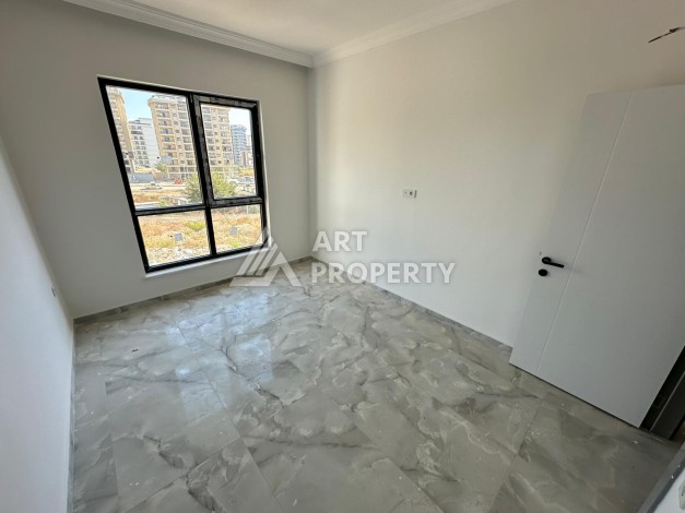 Квартира 1+1 в новом доме в центре Махмутлара, 55 м² - Ракурс 17