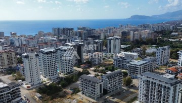 Квартира 1+1 в новом доме в центре Махмутлара, 55 м² - Ракурс 19