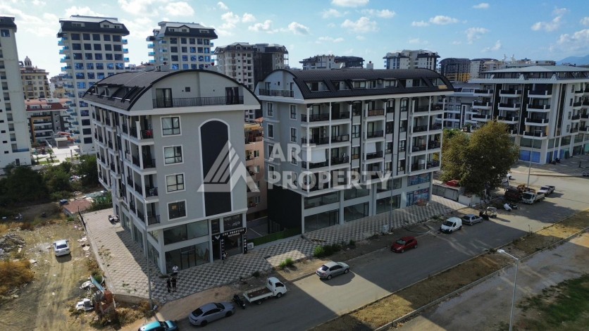Квартира 1+1 в новом доме в центре Махмутлара, 55 м² - Ракурс 19