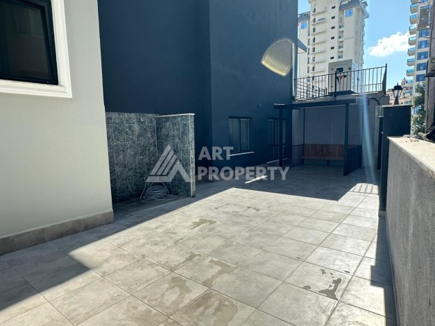 Квартира 1+1 в новом доме в центре Махмутлара, 55 м² - Ракурс 20