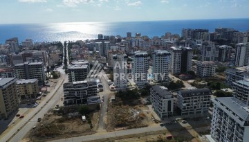Квартира 1+1 в новом доме в центре Махмутлара, 55 м² - Ракурс 22