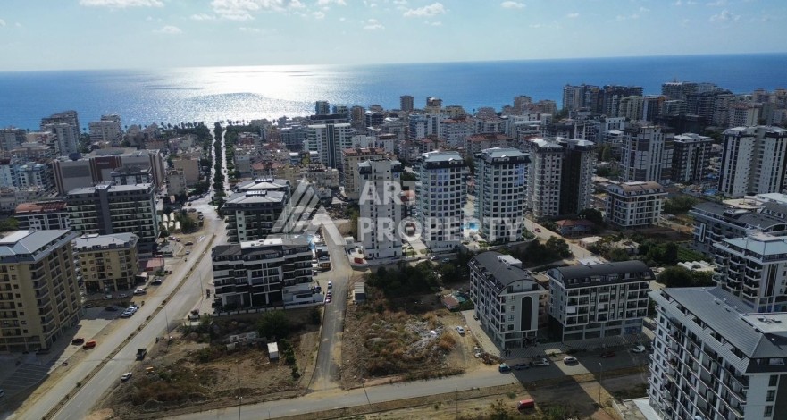 Квартира 1+1 в новом доме в центре Махмутлара, 55 м² - Ракурс 21