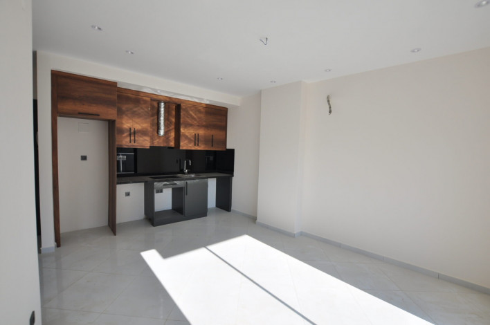 Двухкомнатная квартира в комплексе c инфраструктурой 5-ти звездочного отеля в Махмутларе, 50м2 - Ракурс 4